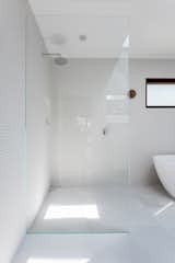 curb-less shower, frame-less glass, textured tile, corner drain 