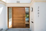 Walnut pivot entry door