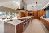 Spacious and bright, the kitchen features a large island with seating and opens up to the living area.