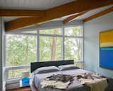 New floor-to-ceiling windows bring dawn light and bird calls into the Master Bedroom.