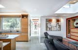 Living Room, Coffee Tables, Sofa, Ceiling Lighting, and Concrete Floor The living room and kitchen.  Photo 1 of 17 in Oak Street by Rossington Architecture