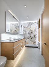 The master bathroom, with its awe-inspiring marble backdrop.