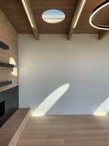 The round skylights create an ever-shifting pattern of sunlight in the living room throughout the day and year.
