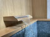 The tub fillers were custom designed to evoke a more natural aesthetic for the Japanese soaking tubs. All of the oak in wet locations were treated with a proprietary glass-infused sealer from Japan.