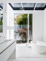Bath, Porcelain Tile, Engineered Quartz, Open, Mosaic Tile, Freestanding, and Full  Bath Full Open Photos from Spruce