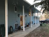 We painted the exterior and removed the shutters for now.  Look at the door! Amazing solid wood.