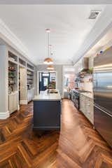Kitchen and Medium Hardwood Floor  Photo 8 of 19 in Kitchen by Pixy Interiors from A LONG TOWNHOUSE SETS THE RIGHT FLOW FOR MODERN LIVING (PART 2, SWEETEN project)