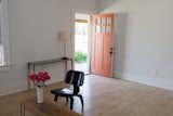 entry in living room; Blu Dot by Target console; heirloom copper and wrought-iron lamp