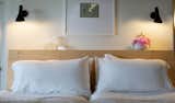 custom-fabricated spruce headboard by Austin McLure