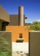 The outdoor fire place is an extension of the luxury kitchen, taking advantage of the clear blue New Mexico skies