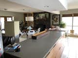 Another view of the outdated fireplace and shelves. 