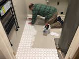New tile going down in the laundry room. 