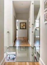 Glass bridge with view to living room below