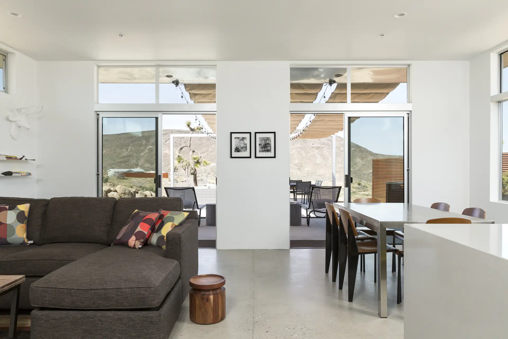 The living room of the main house has direct connections to the outdoors and the patio.