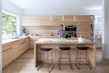 The custom kitchen millwork was designed by local furniture designer and manufacturer, Christian Woo.