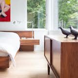 Custom platform bed by Christian Woo lies perfectly beneath the bedroom windows.