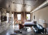 Room 1, located on the 2nd floor,  blends industrial detailing with exposed brick walls, polished concrete floors, rich textile finishes, and a custom walnut bed.