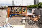In the Poplar Dock Marina of London sits a 1924 barge that has been transformed into Beecliffe, a contemporary floating home with simple, sophisticated interiors.