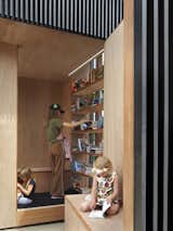 Wrapped in marine grade veneer plywood, the interior walls frame a warm oasis for reading and viewing.