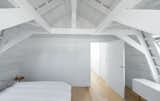 Bedroom, Bed, Storage, and Light Hardwood Floor  Photo 9 of 10 in A Cramped Amsterdam Apartment Is Transformed Into an Airy Loft