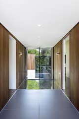 Windows and Picture Window Type Large format Fiandre floor tiles fill the entry sequence and align with the building module.  Photos from An Incredible Forest Home Leaps Over a Ravine