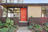 Doors, Exterior, Wood, and Swing Door Type A mid-century modern color palette decorates the exterior.  Brightly colored doors highlight the home's entry.  Photo 1 of 14 in A Bay Area Jewel With Golden Gate Views Wants $1.55M