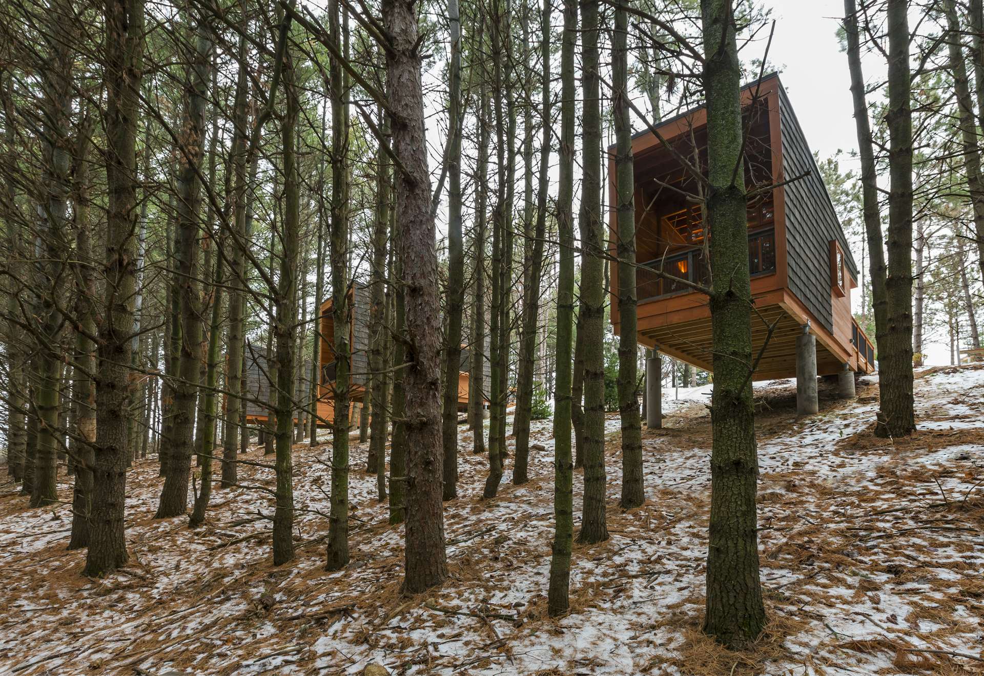 Designed by HGA Architects and Engineers—a firm with offices in eight cities across the country, including Minneapolis—these prefab cabins were designed off-site before being transported and set atop a series of concrete piers.