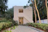 The two-story addition completed by Steven Ehrlich, FAIA,  is painted white and accented with green trim.   Photos from Richard Neutra’s Boxcar-Style Loring House Lists for $8M in the Hollywood Hills