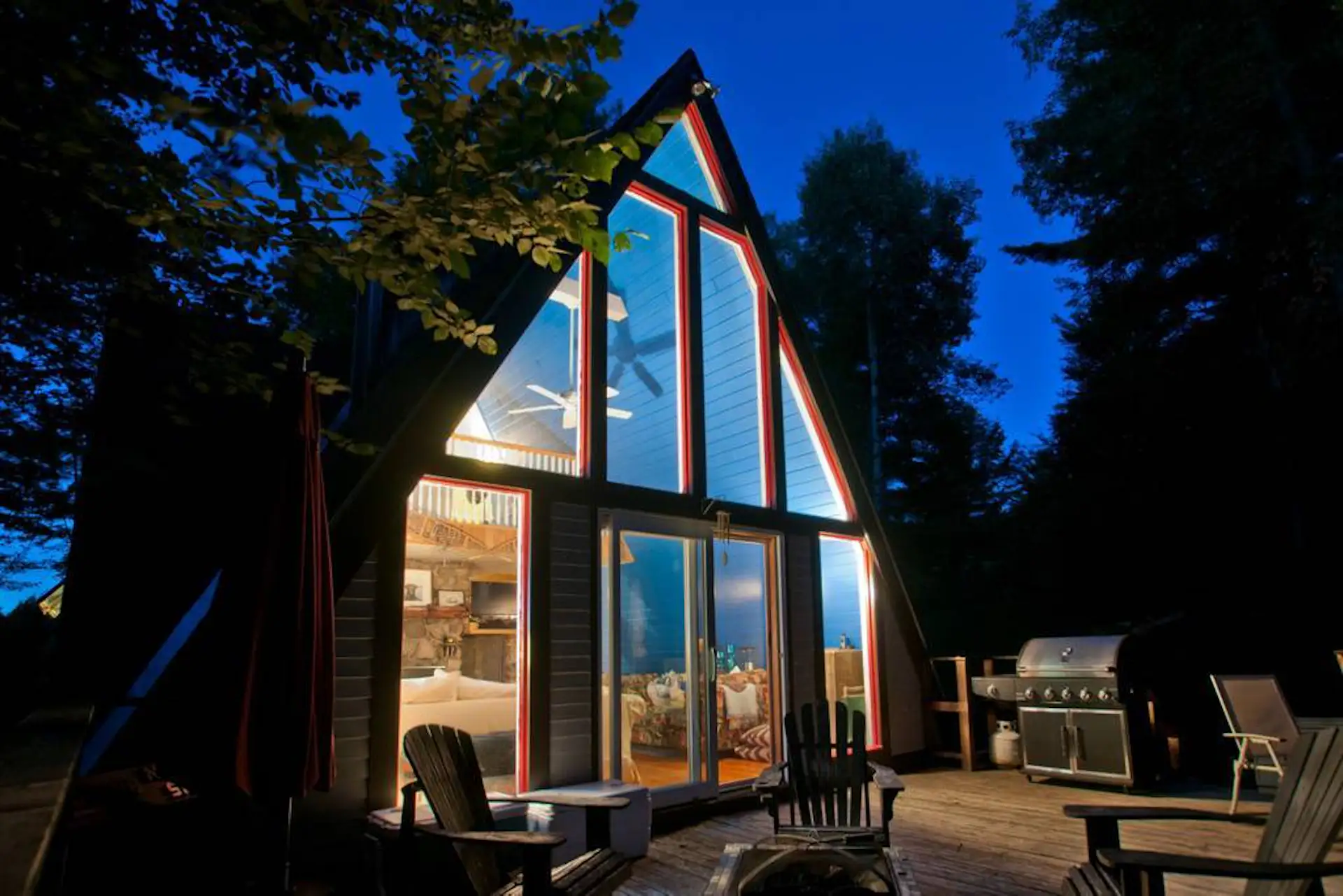 A cozy A-frame with views of Whiteface Mountain, this dwelling features a living room, fireplace, loft bedroom, and fully equipped kitchen.
