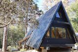 This modern A-frame cabin near Yosemite can accommodate three guests. The A-Frame shape fills the cabin with natural light, and a dark clad exterior contrasts with the warm, honeyed hues of the interior.&nbsp;