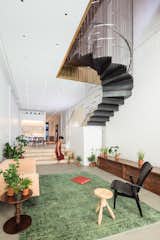 Living, Sofa, Rug, End Tables, Stools, Bench, and Chair The stair is partially suspended from the ceiling above, allowing the living space to maintain its usable space and height.   Living Chair Rug Bench Stools Photos from A Steel Staircase Merges Two Units Into One in Tribeca