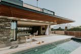 Outdoor, Wood, Large, Swimming, Large, and Wood The outdoor swimming pool is just steps from the comfort of the living spaces.  Outdoor Wood Wood Large Photos from An Inviting South African Cottage Embraces Its Seaside Locale
