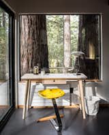 A small office spaces overlooks the redwood surroundings. 