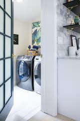 The enlarged laundry room provides just enough space for the growing family. 