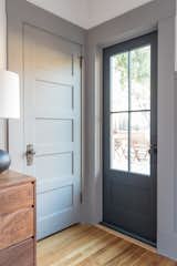 Doors, Swing Door Type, Wood, and Exterior The custom made door from Pella aligns perfectly with the original details of the home.  Photos from Budget Breakdown: A San Diego Couple Make Over Their Craftsman Bedroom For $29K