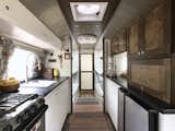 Jonathan and Ashley Longnecker and their four kids downsized from a spacious home to live in their 1972 Airstream Sovereign. In just six months, the couple transformed the vintage trailer into an off-grid family residence complete with built-in storage, colorful decor, and a workspace.