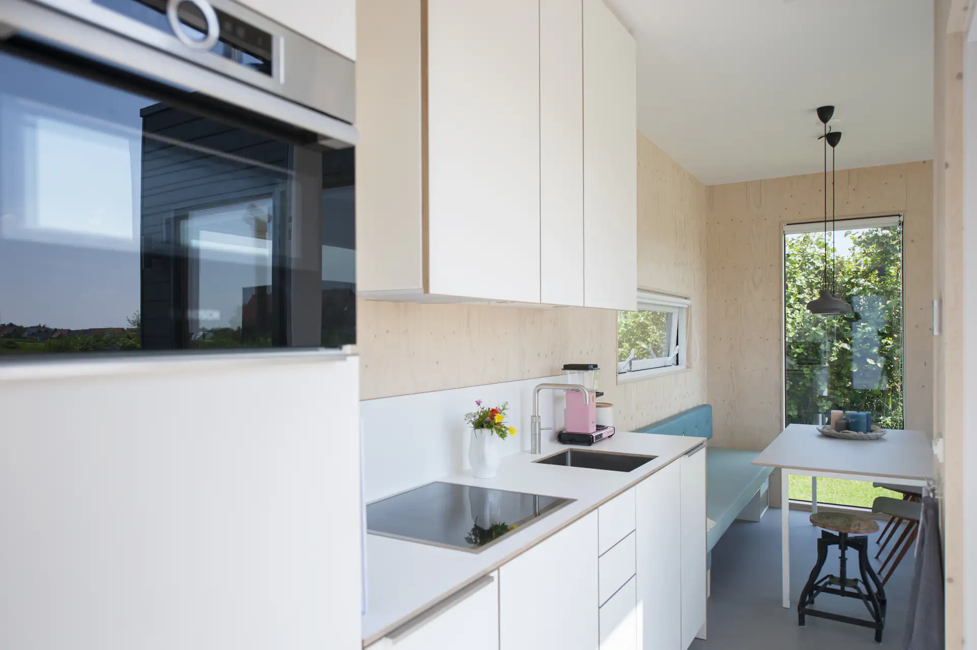 A fully equipped kitchen provides all the needed amenities for a luxurious cabin retreat.