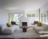 Living, Wood Burning, Recessed, Sofa, Coffee Tables, Chair, Medium Hardwood, Rug, and Standard Layout Although the spaces have been updated, the home's midcentury style shines through.  Living Coffee Tables Medium Hardwood Recessed Standard Layout Photos from Rufus Stillman Cottage