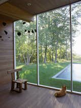 Outdoor, Wood, Hanging, Small, Grass, Swimming, and Wood Screened-in porches run the length of the addition, creating a seamless connection between indoor and outdoor living spaces.  Outdoor Small Wood Grass Photos from Here’s Your Chance to Own an Iconic Home Designed by Marcel Breuer