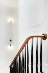 The revamped staircase blends traditional and modern.