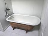 Before: The designers kept the existing clawfoot tub for use in the new design.