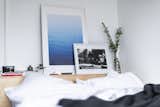 Artwork by local Canadian artists adorns the built-in bed. 