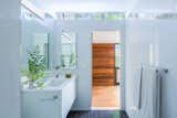 Treehaus bathroom with white tile and clerestory window