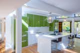 Treehaus kitchen with white and green cabinetry
