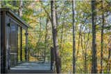 Off the master bedroom, a private deck looks out to the forest.