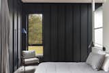 Abercorn Chalet bedroom with black corrugated metal walls
