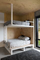 Built-in bunk beds embody the playfulness of camping.