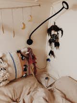 A dream catcher, memory foam mattress, and down comforter make the van truly feel like home.