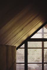 The continual use of wood creates warmly lit interiors that accentuate the simple, gabled formwork.