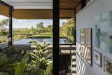 Staircase Picturesque views of the surrounding countryside are eminent at every corner of this home. Large openings fully embrace the surroundings.   Photo 10 of 12 in A Green Roof Helps Camouflage This Striking Home in Brazil